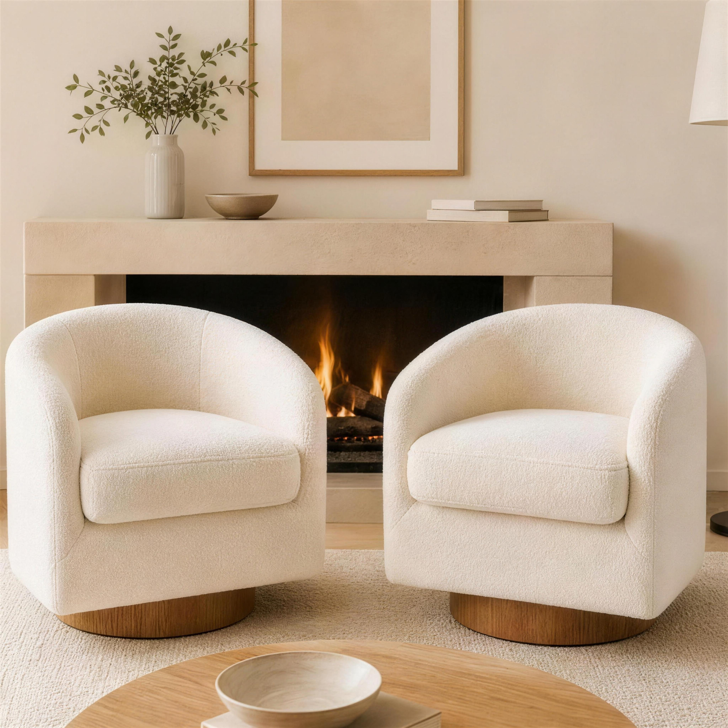 Two Cove teddy khaki barrel swivel accent chairs on round wooden plinths flanking a fireplace