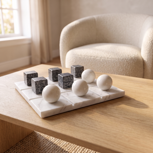 Black and white marble tic tac toe set on an oak coffee table