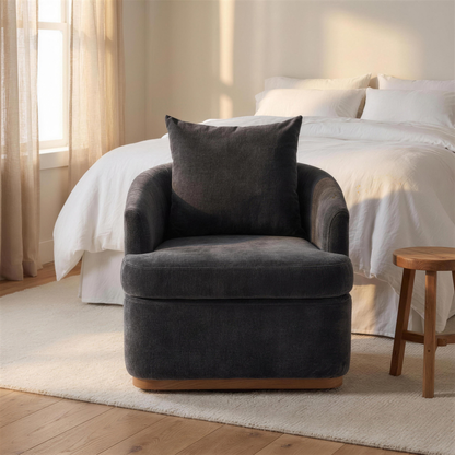 Ridley chair seen from the front at the foot of a bed in a calm bedroom