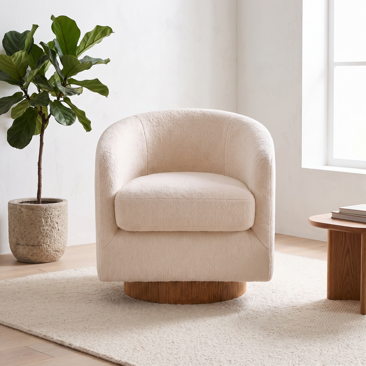 Cove teddy khaki barrel swivel accent chair in a sunlit living room beside a fiddle leaf fig