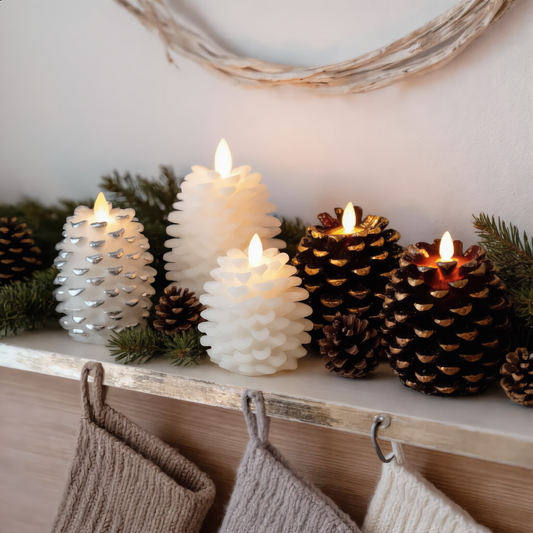 Hazel flameless LED pinecone candle glowing on a fireplace mantel with pine garland
