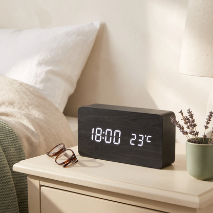Wooden LED Alarm Clock, Black Block, on a cream nightstand